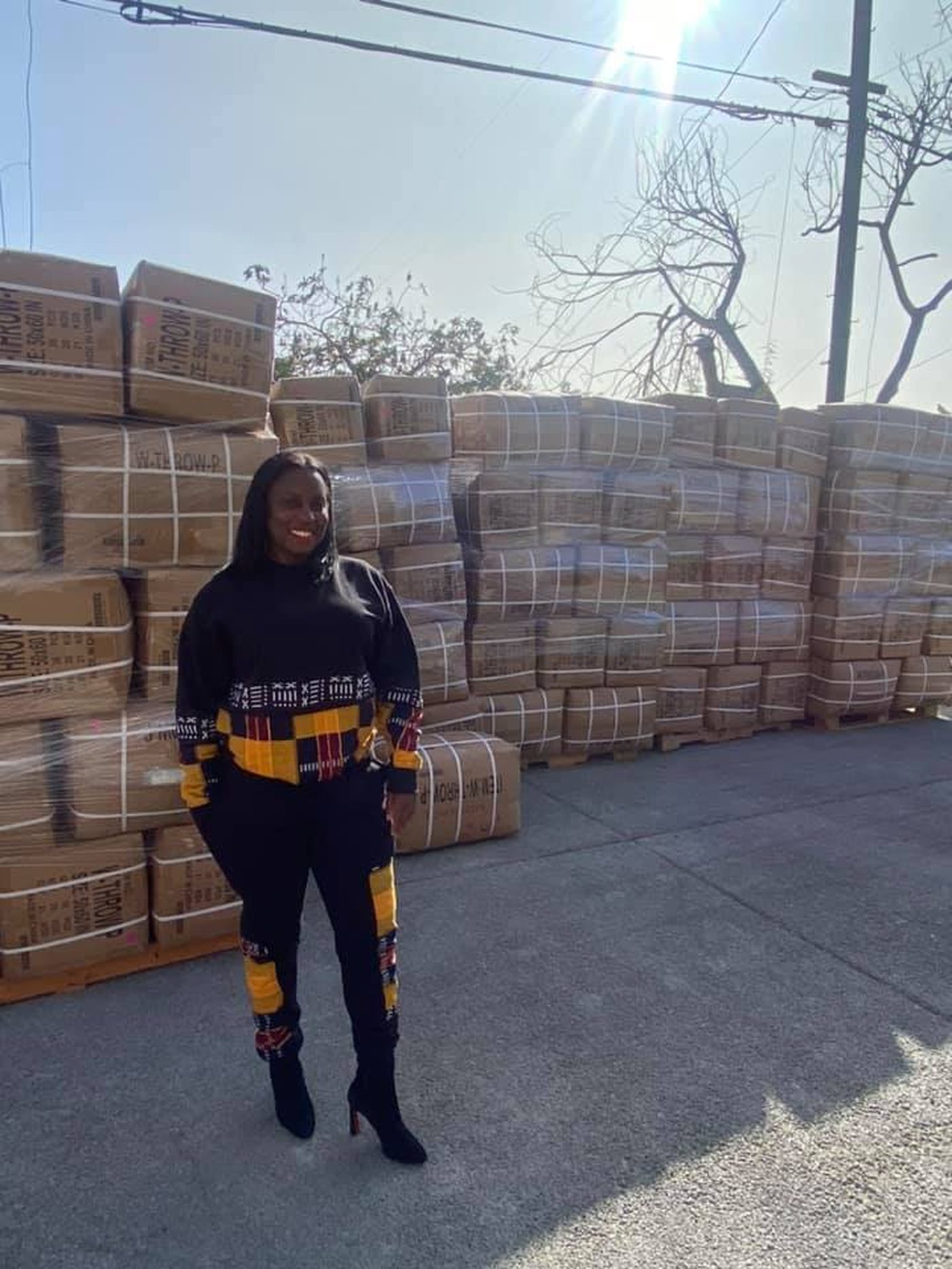 Kenya Croom with pallets of 10,000 blankets delivered for Warm the Streets